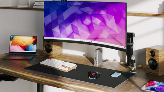 A desk with a CalDigit TS4 dock connected to a MacBook Pro and an ultra-wide monitor
