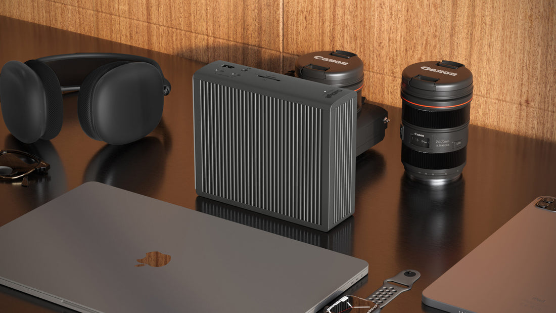 A TS5 Plus on a desk standing upwards with accessories around it.