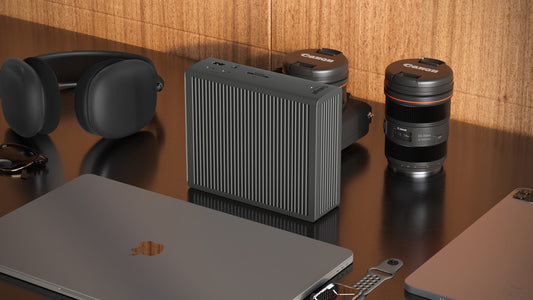 A TS5 Plus on a desk standing upwards with accessories around it.