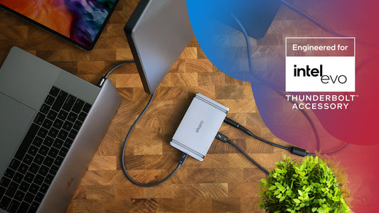 An image of the CalDigit Element Hub on a desk connected to a MacBook Pro via Thunderbolt cable. The "Engineered for Intel EVO - Thunderbolt Accessory" logo is on the image.