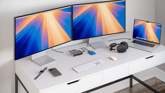 An image of a desk with dual monitors, a MacBook Pro, and the CalDigit Element 5 Hub.