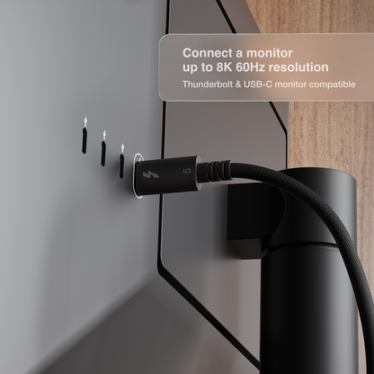 A close-up of a CalDigit Thunderbolt 5 cable plugged into a Thunderbolt monitor, with text overlay stating 'Connect a monitor up to 8K 60Hz resolution Thunderbolt & USB-C monitor compatible'.