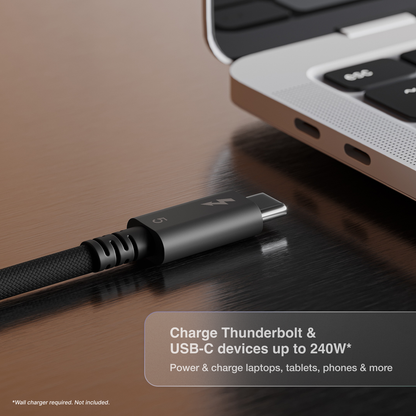 A close-up of a CalDigit Thunderbolt 5 cable next to a MacBook. Text overlay at the bottom reads 'Charge Thunderbolt & USB-C devices up to 240W* Power & charge laptops, tablets, phones & more'.