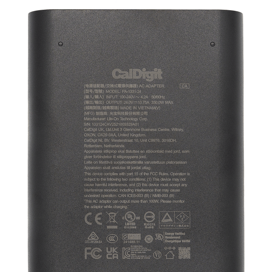Back view of a CalDigit AC adapter with text and logos.