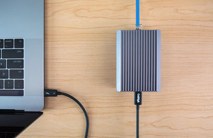 Connect 10g connected to a laptop with a thunderbolt cable with an ethernet cable attached on the other side