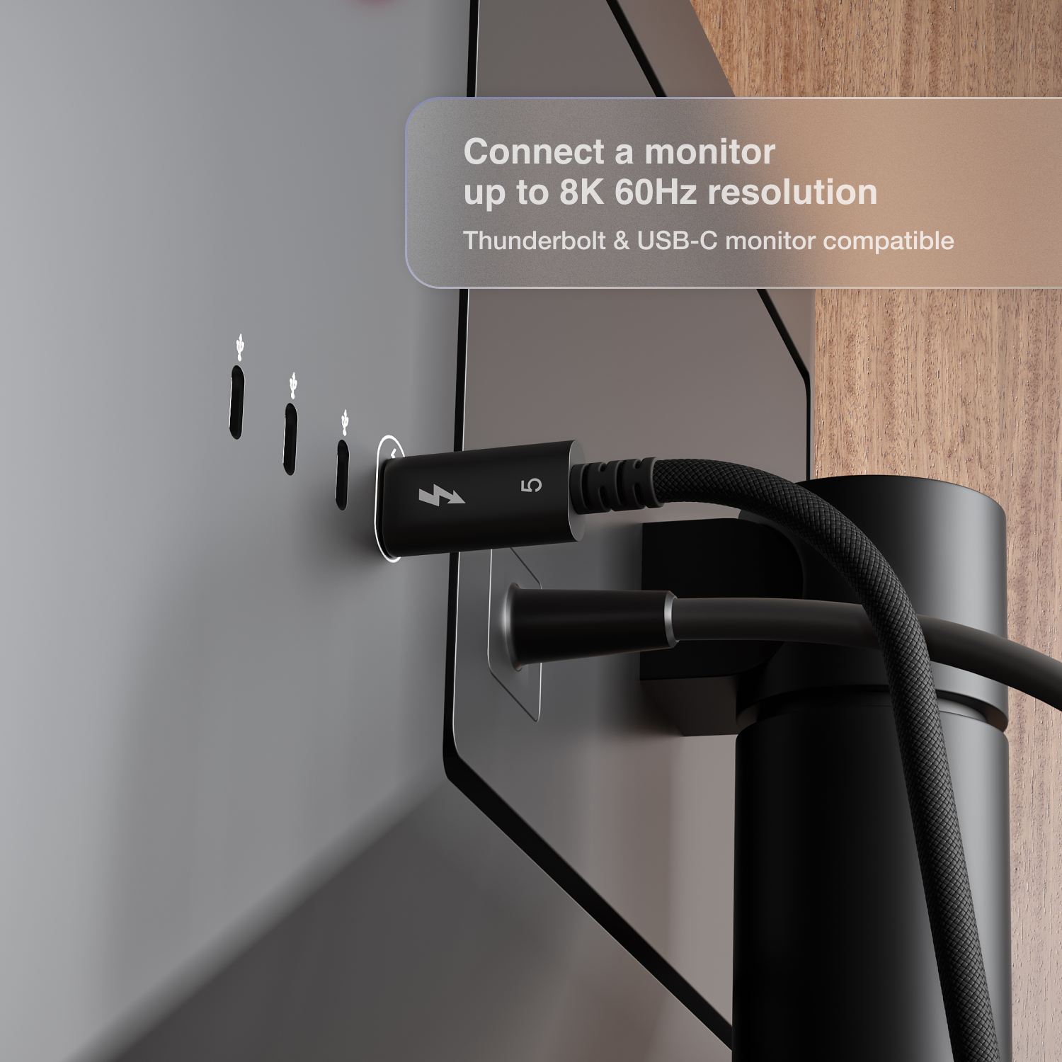 Cable being plugged into a monitor with text about compatibility and resolution.