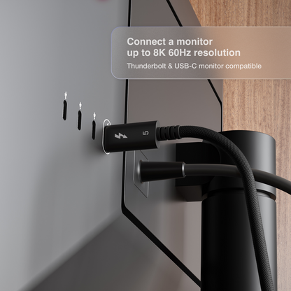 Cable being plugged into a monitor with text about compatibility and resolution.